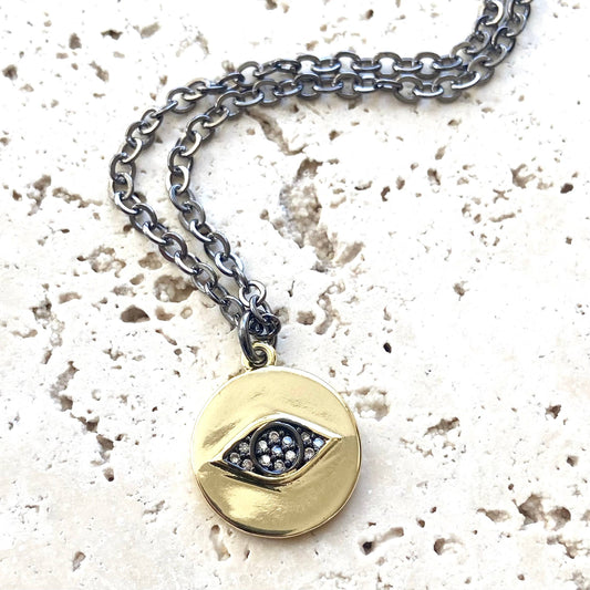 Evil eye on gold disc necklace
