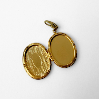 Vintage gold tone oval locket charm, alternate view 2