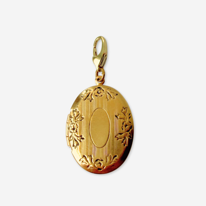 Vintage gold tone oval locket charm